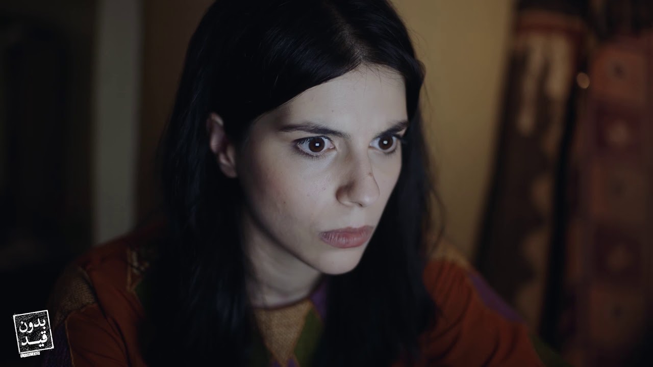 Reem from Bidune Kaid, lit by a screen